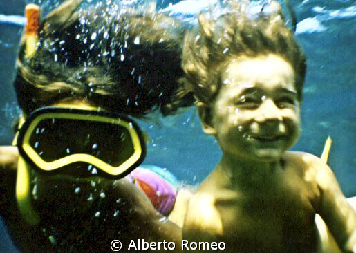 My son Dario at the age of about 2 y.o.  free skindiving ... by Alberto Romeo 