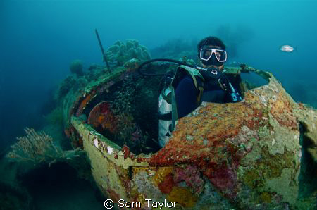 Japanese WWII wreck & our dive guide, Madang Province PNG... by Sam Taylor 