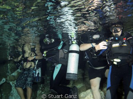 Divers in chandelier cave. by Stuart Ganz 