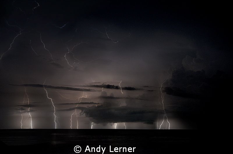 Multiple exposure of a storm over the waters near Amed Bali. by Andy Lerner 