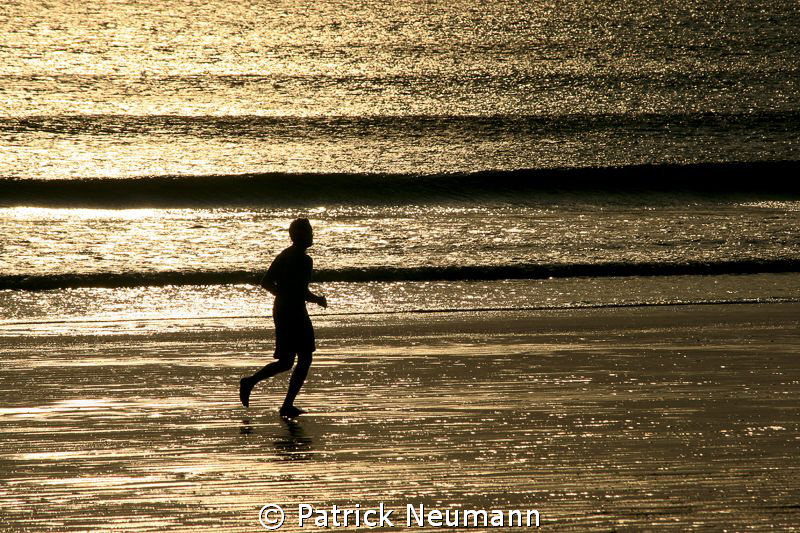 jogging at the beach .. by Patrick Neumann 