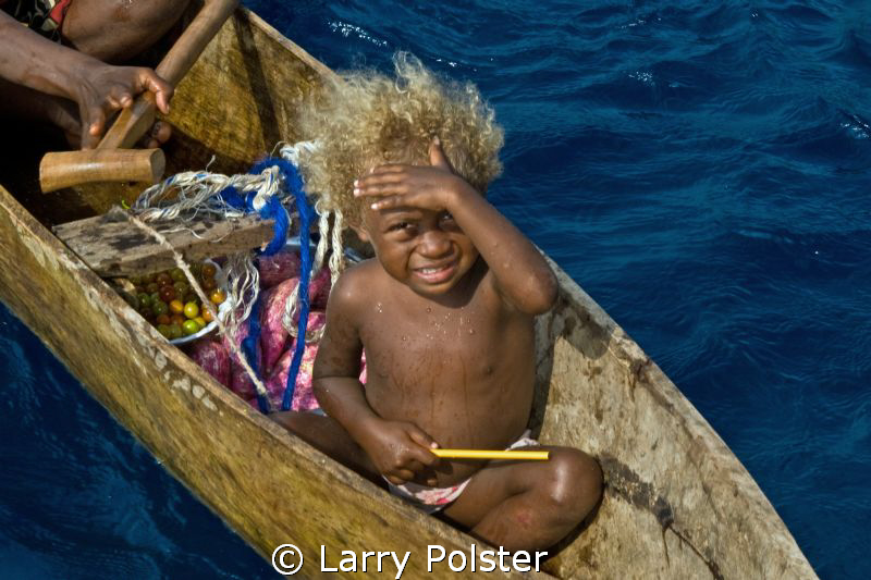 The unusual blonde hair of some of the local children fou... by Larry Polster 
