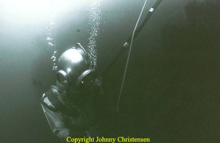 Diver from The Historical Diving Team of Denmark tries to... by Johnny Christensen 