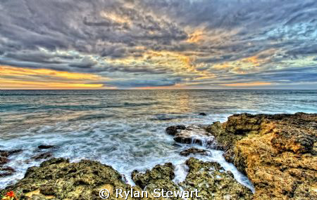 The sunset off of Makaha Hawaii. by Rylan Stewart 