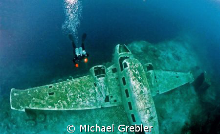 Diver and plane wreck in Morrison's Quarry. Photo taken u... by Michael Grebler 
