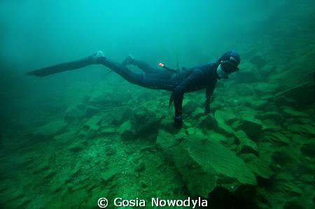 Freedom in diving, a single breath, deep blue and the roc... by Gosia Nowodyla 