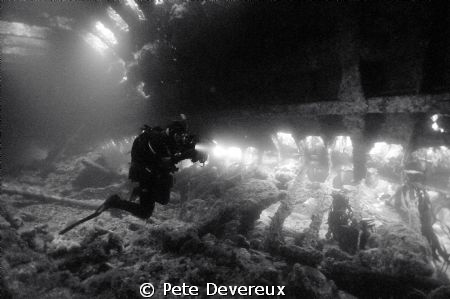 Inside the hull of the Tabarka in Scapa Flow.  The diver ... by Pete Devereux 