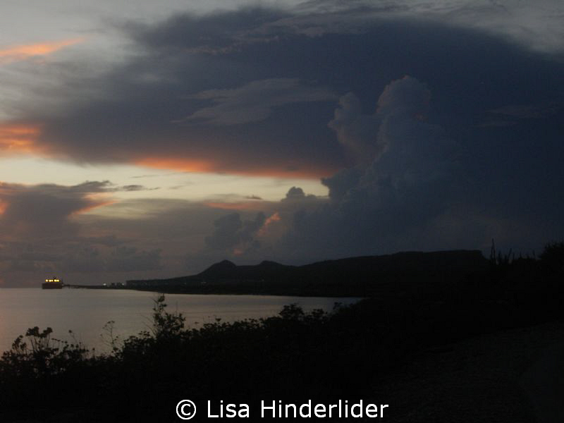 A look at the night sky as it comes rumbling in after a l... by Lisa Hinderlider 