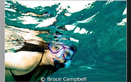 Snorkeling before committing to the dive. by Bruce Campbell 