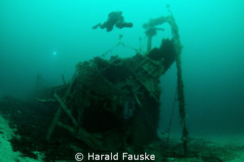 Diver over the stern of "Hilda" sunk  in 1875, now restin... by Harald Fauske 