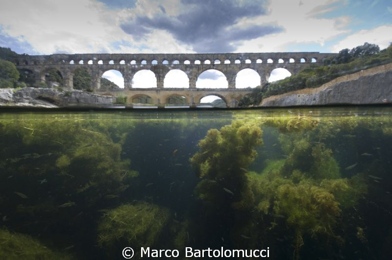 Pont du Gard - Gard River France.  The ancient roman brid... by Marco Bartolomucci 