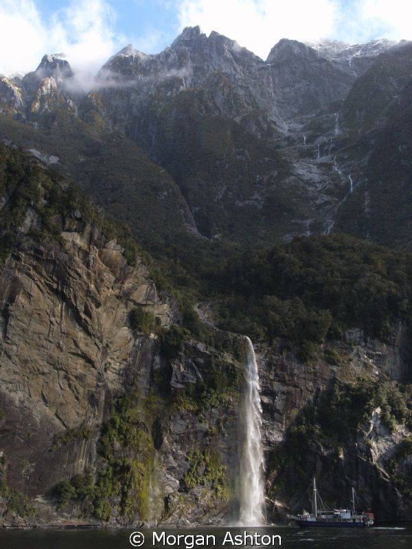Milford Sound waterfall -from the clouds to the sea. Some... by Morgan Ashton 