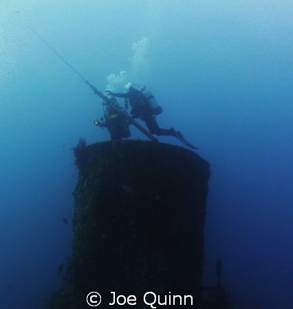 Divers beginning ascent from smoke stack, USS Duane, Key ... by Joe Quinn 