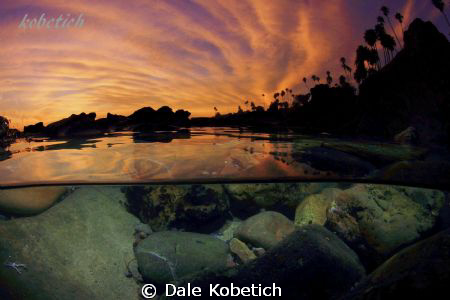 Half above / below image of a epic Laguna Beach sunset...... by Dale Kobetich 