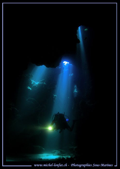 Diving the small caves in the Red Sea... :O)... by Michel Lonfat 