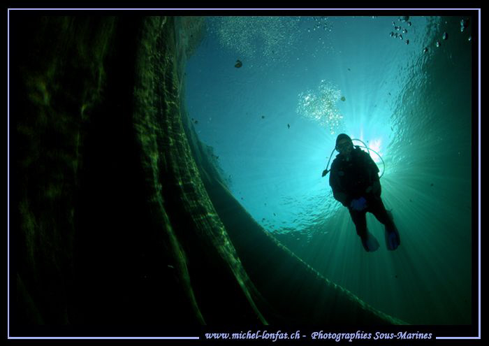 My wife diving the Verzasca River... :O)... by Michel Lonfat 