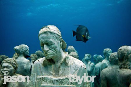 Taken on the underwater Museum in Cancun. Grey angel behi... by Jason Decaires Taylor 