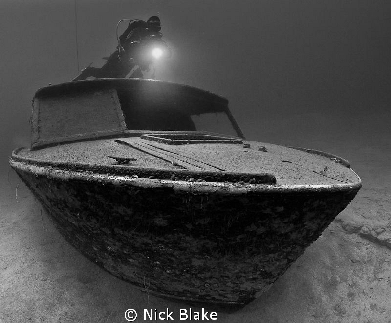 Boat wreck and diver
Wraysbury lake, Middlesex, UK.
 by Nick Blake 