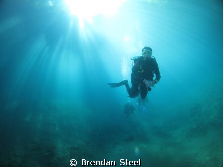 Parting the Rays - Blue Hole Santo Vanuatu. Taken with Ca... by Brendan Steel 