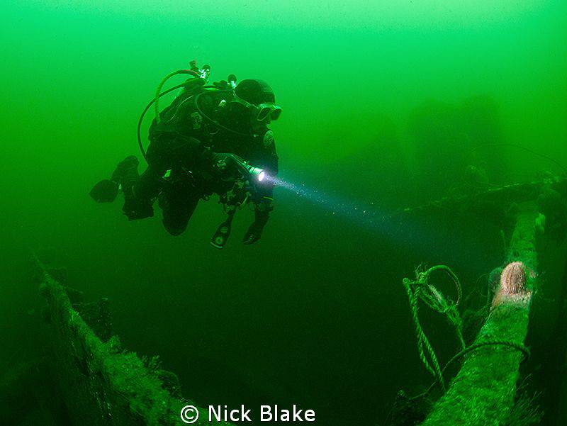 Diver exploring the wreck of the Somali, Northumberland by Nick Blake 