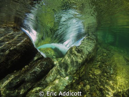 Looking downstream into the tongue of a small waterfall/r... by Eric Addicott 
