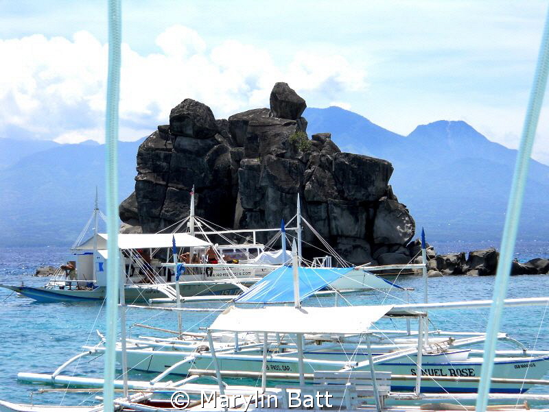 Lunch at Apo Island had this beautiful rock back drop. by Marylin Batt 