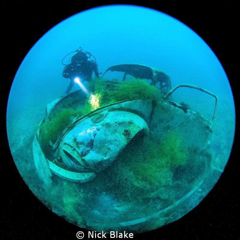 VW Beetle and diver at Capernwray by Nick Blake 