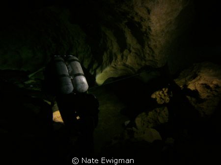 N. Florida cave diver with doubles leaving the cavern zon... by Nate Ewigman 