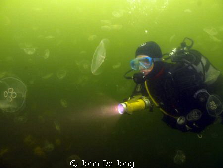 Nathalie between the jellyfish at lake Grevelingen, the N... by John De Jong 