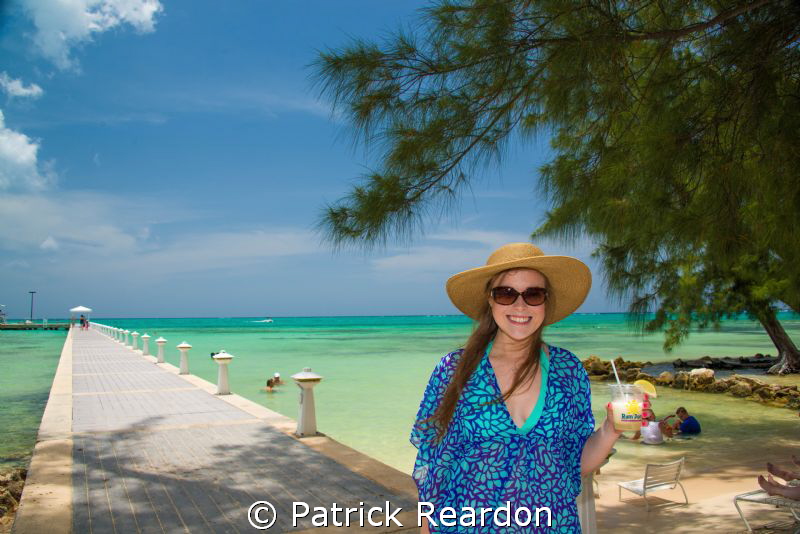 Taking a break from diving.  Daughter at Rum Point, Grand... by Patrick Reardon 
