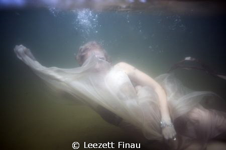 I captured this image of a bride during a drown the gown ... by Leezett Finau 