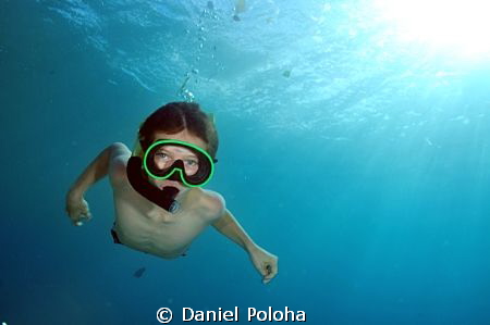 Young freediver descending by Daniel Poloha 