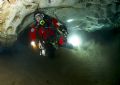 Diver in Engelbrechts Cave, South Australia. Remote slave strobe behind diver.