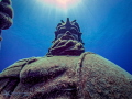 The Guardian - a Simon Morris statue standing just off the mini-wall at LightHousePoint in Grand Cayman.  Loved how the sun makes a Halo - always guarding for good ....