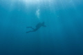 A Diver seen from afar in low visibility