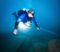Diver on the wreck of the Dee Why Ferry at 45m (150 ft) depth in Sydney, Australia