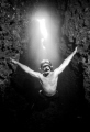 matt, free diving in the rock arch. ambient light