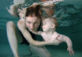Pool photo of 7 months old Samuel with his mum. I like the way the little boy is touching and looking at his mum even under water.