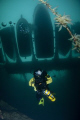 Re-breather diver hanging around under the pir.