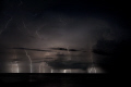 Multiple exposure of a storm over the waters near Amed Bali.