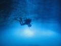 Diver (Girts Kravalis) floating over toxic Hidrogen Sulfide cloud in Cenote The Pit in Playa del Carmen with Playa Scuba