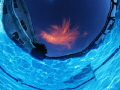 Sunset from the bottom of the pool...just one cloud up there tonight.  Used a weak flash to light up the inside of the pool.