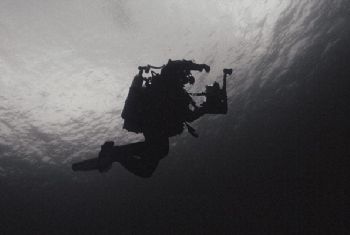 Dark descent. Descending to 40m wreck in the dark waters ... by James Garland 