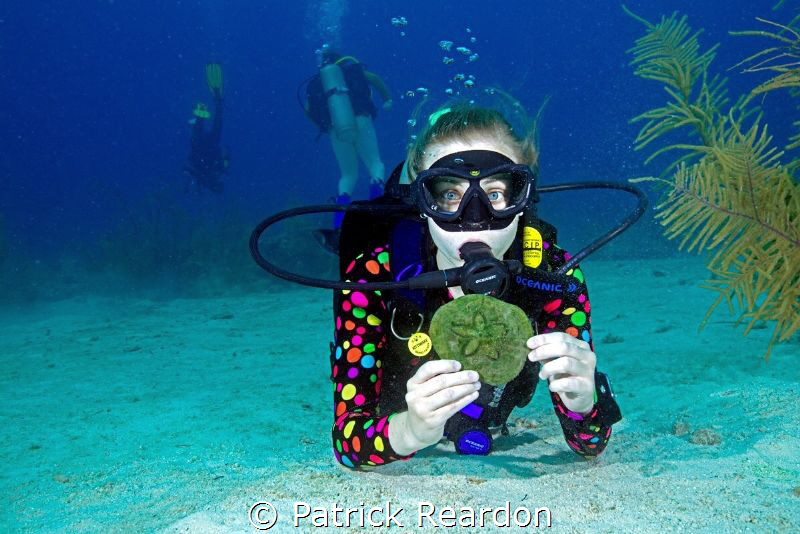 Daughter, Jenny, with a sand dollar. by Patrick Reardon 