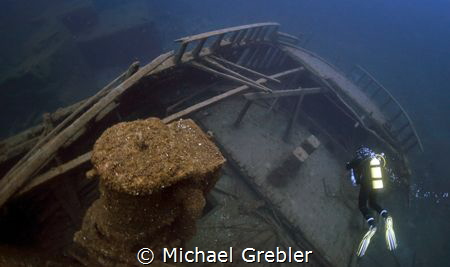 Sitting at a depth of 150-feet, a diver explores the ster... by Michael Grebler 