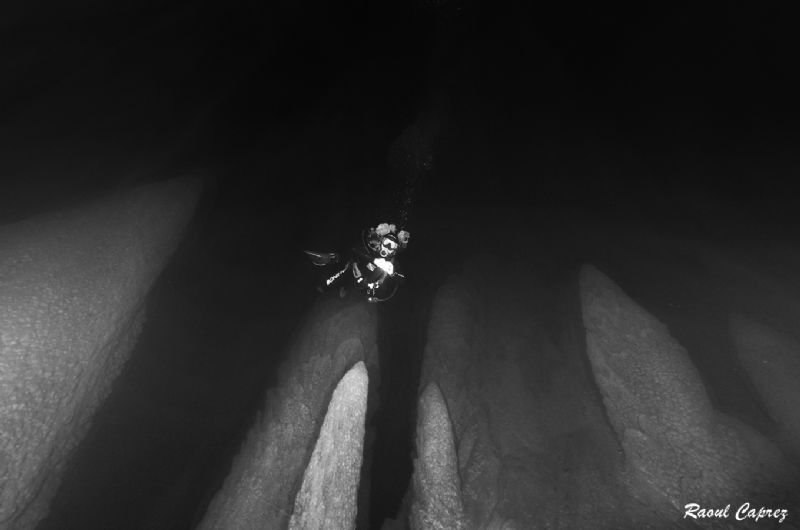 Diving between the stalagmits by Raoul Caprez 