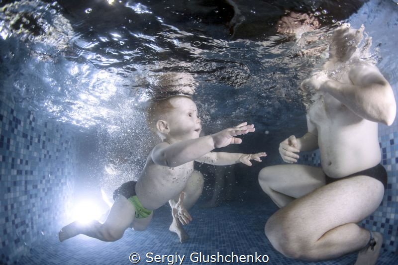 Children swimming by Sergiy Glushchenko 