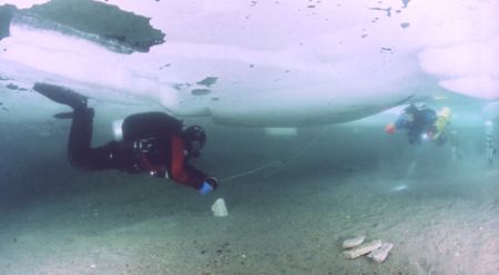 Divers completing an ice dive at Morrison's Quarry (Quebe... by Michael Grebler 