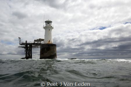 Diver's view of a lighthouse by Peet J Van Eeden 