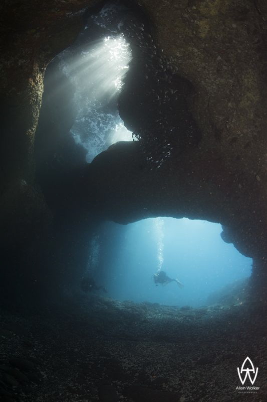 "Cap la Houssaye" - Divers exploring the volcanic tunnels... by Allen Walker 